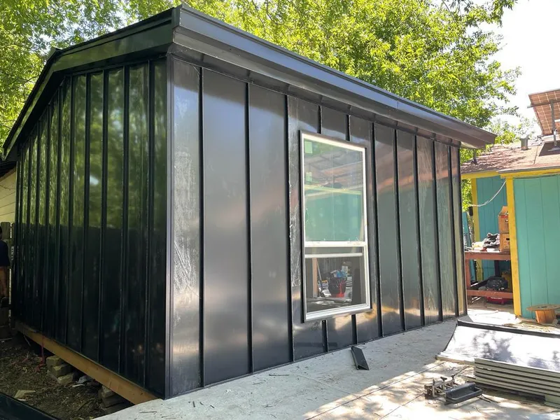 Black standing seam metal wall panels for Roof Inspection in Huntington Woods