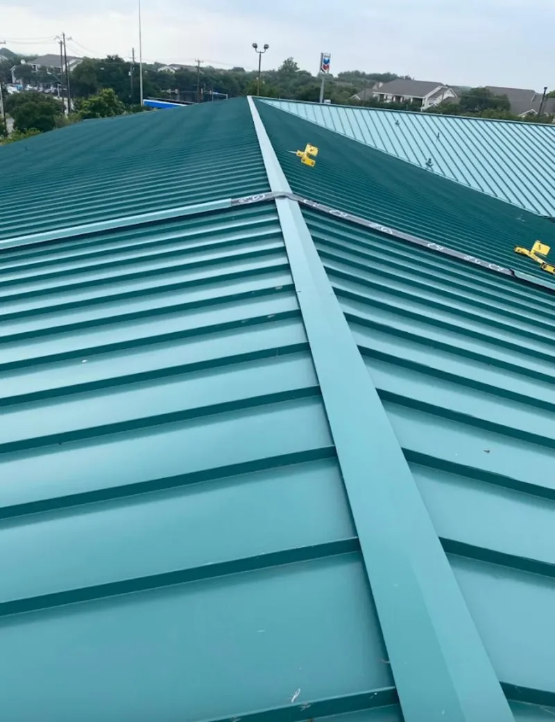 Green commercial metal roof ridge and valley for Metal Roof Repair in Huntington Woods