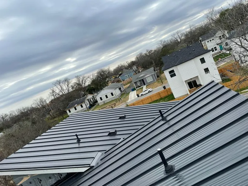 Standing seam metal roof panels with vents for Skylight Repair in Huntington Woods